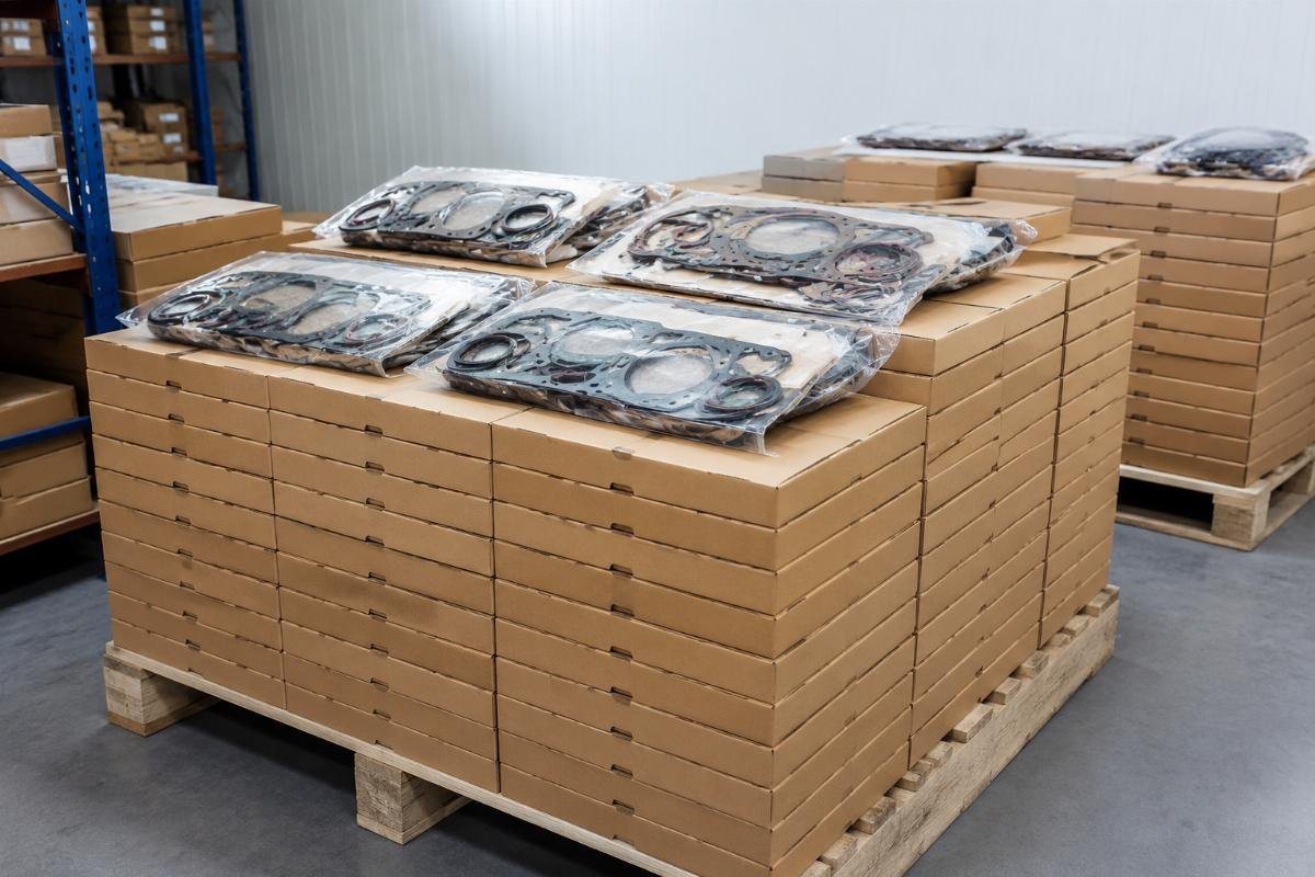 Single unit gasket kit dispatch Stack of single-unit overhaul gasket kits ready for dispatch from a warehouse